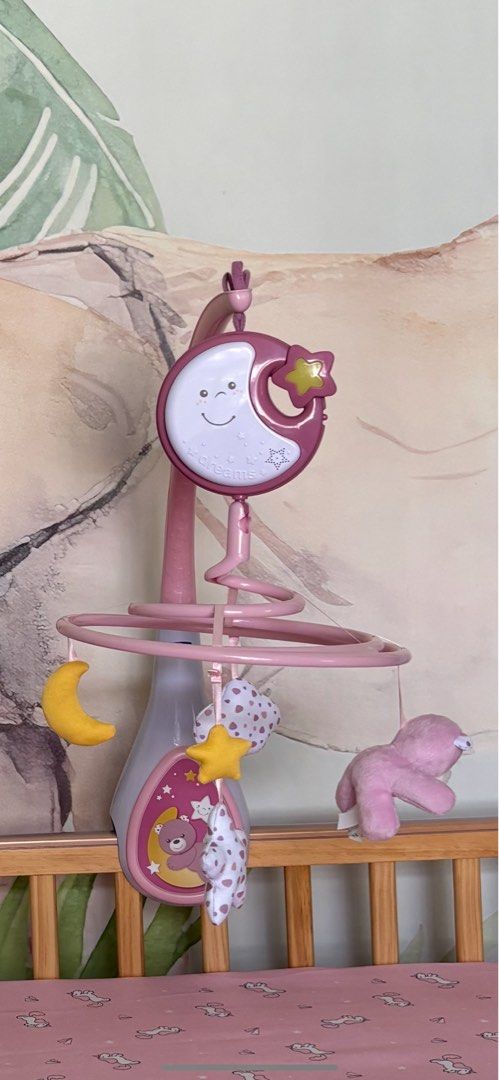 Chicco First Dreams Next2Dreams 3-in-1 Cot Mobile (Category: Cots & Cribs) located in Quezon City. Submitted by sabmarine (Listing ID 1409498853, Image 3). Description: - Chicco Next2Dreams 3-in-1 cot mobile - Pink color with moon and star designs - Compatible with Next2Me cribs and wooden cribs.