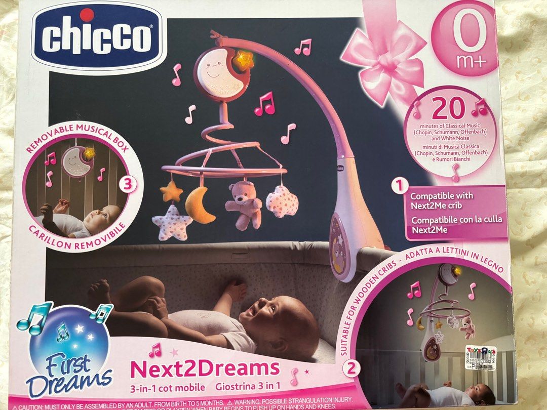Chicco First Dreams Next2Dreams 3-in-1 Cot Mobile (Category: Cots & Cribs) located in Quezon City. Submitted by sabmarine (Listing ID 1409498853, Image 1). Description: - Chicco Next2Dreams 3-in-1 cot mobile - Pink color with moon and star designs - Compatible with Next2Me cribs and wooden cribs.