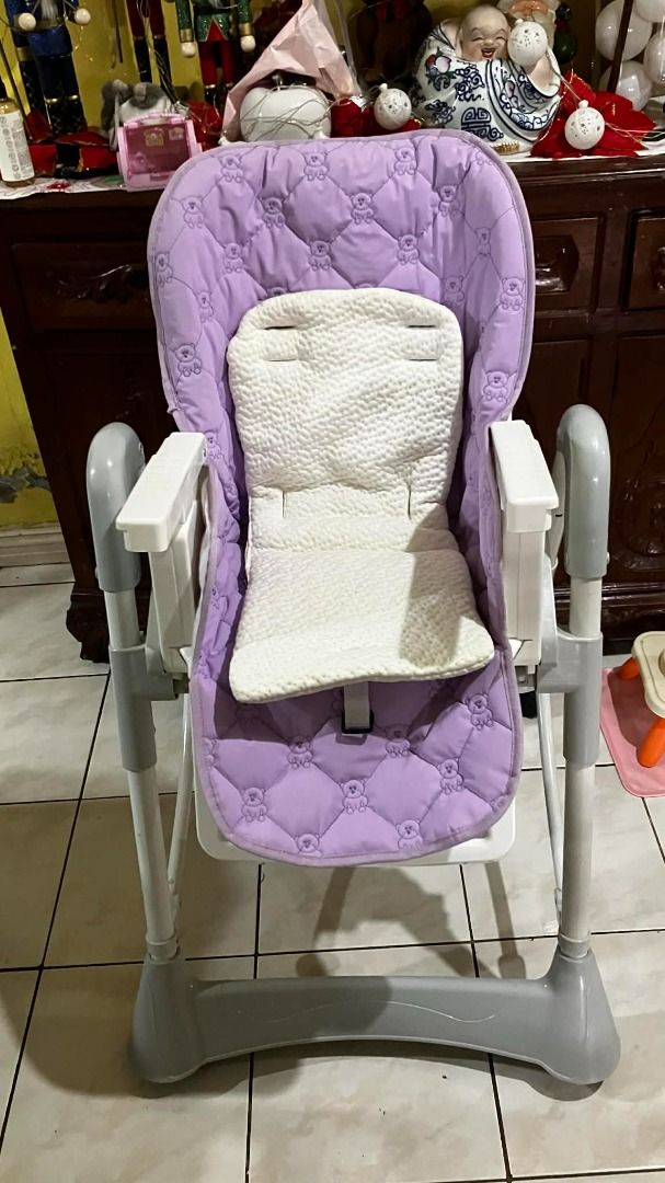 Cuddle Bug Baby High Chair with Tray (Category: Baby High Chairs) located in Paranaque City. Submitted by trishyy19 (Listing ID 1409549788, Image 3). Description: - Removable tray for easy cleaning - Purple seat with adorable teddy bear pattern - Comfortable white cushion - Sturdy and safe frame - Adjustable height settings - Perfect for safe and comfortable mealtimes - 5 Adjustable height positions - 5-Point harness - 3-Position comfortable recl