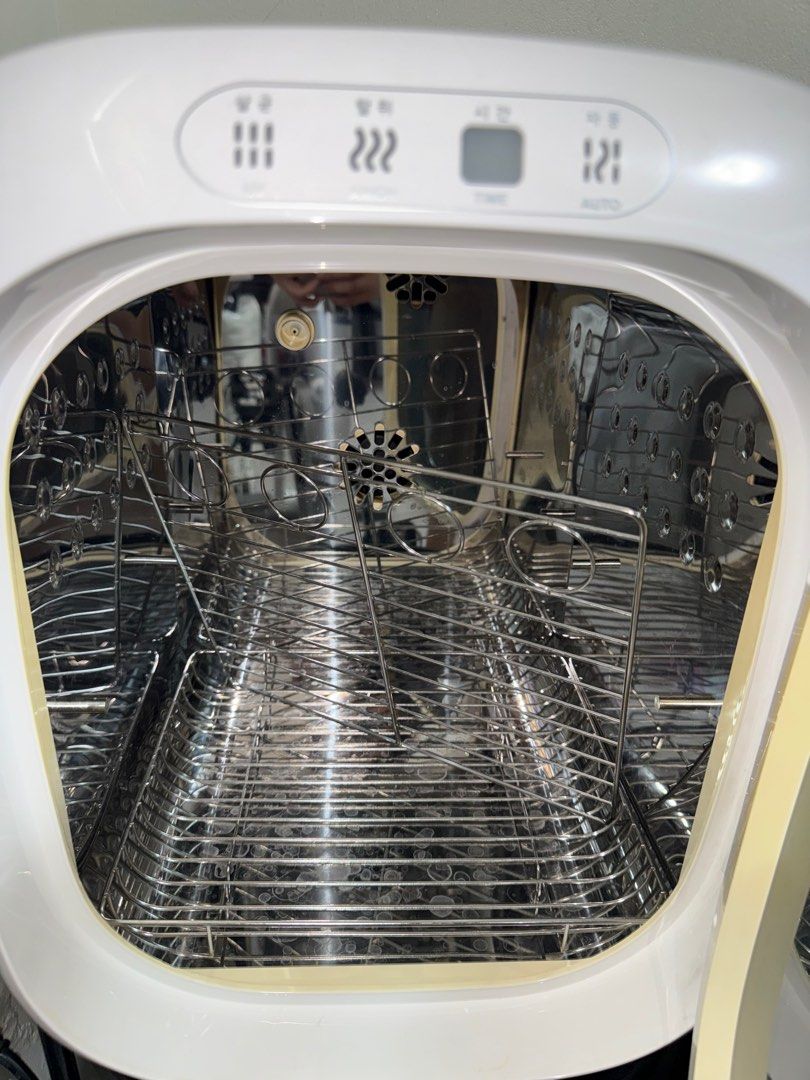 Ecomom Baby Bottle Sterilizer (Category: Breastfeeding & Bottle Feeding) located in Pasig City. Submitted by helpsisdeclutter (Listing ID 1409472072, Image 3). Description: - Ecomom baby bottle sterilizer - Sterilizes and dries baby bottles and accessories - Features multiple settings - Interior with multiple racks - Stylish white exterior with silver trim - Includes power cord.