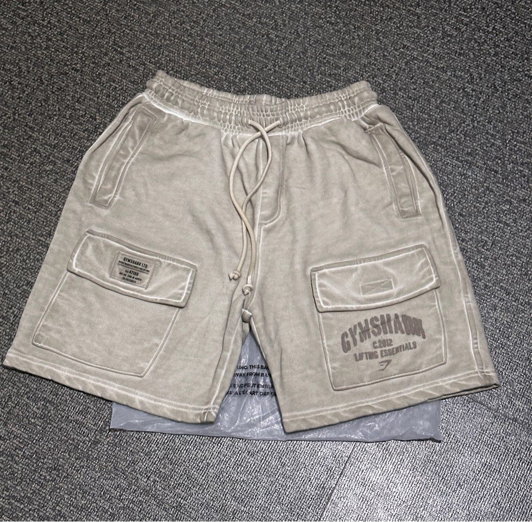 Gymshark OS cargo shorts (Category: Shorts) located in Bulacan. Submitted by fitloop_ph (Listing ID 1409597989, Image 1). Description: Gymshark OS Cargo Shorts Color: pebble gray (may pagka cream in person) Brand new and authentic From UK .