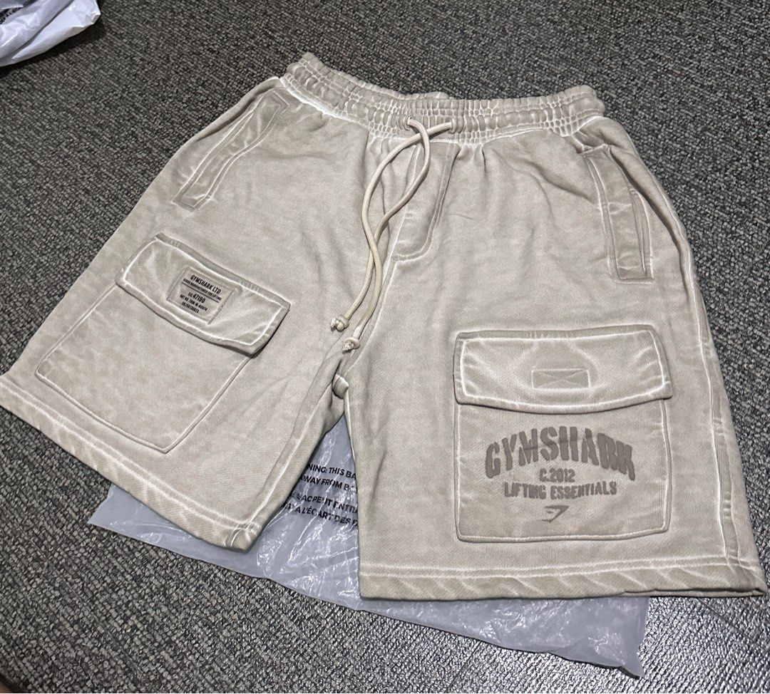 Gymshark OS cargo shorts (Category: Shorts) located in Bulacan. Submitted by fitloop_ph (Listing ID 1409597989, Image 2). Description: Gymshark OS Cargo Shorts Color: pebble gray (may pagka cream in person) Brand new and authentic From UK .