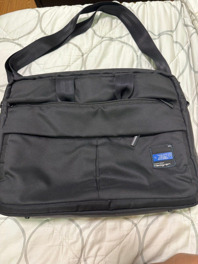 Hedgren Laptop Bag (Category: Laptop Bags & Sleeves) located in Quezon City. Submitted by dadathegreat (Listing ID 1409525402, Image 2). Description: - Black Hedgren laptop bag - Multiple compartments for organization - Padded section for laptop - Detachable shoulder strap - Zippered front pocket - Sleek design Condition - no issues - all zippers working - signs of usual usage - no tears or holes - Designed in Belgium.