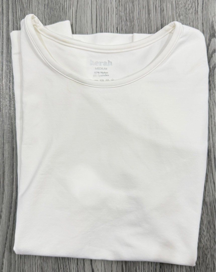 Herah Seamless T-shirt - White (Category: Shirts) located in Manila. Submitted by narshmallow (Listing ID 1409524816, Image 1). Description: - Herah seamless t-shirt - Color: White - Size: Medium - Material: 92% nylon, 8% spandex - Features: Crew neck, short sleeves - Style: Smooth, form-fitting Rfs: i prefer bigger size for me.