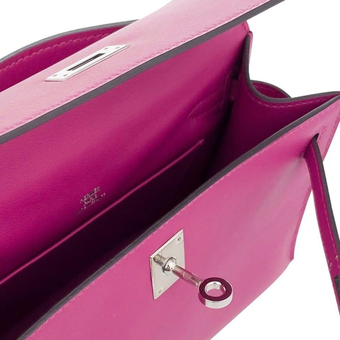 Hermes Mini Pochette Rose Pourpre (Category: Luxury Bags & Wallets) located in Manila. Submitted by mariasells05 (Listing ID 1409520127, Image 2). Description: - Authentic Hermes Mini Pochette - Color: Rose Pourpre - Features top handle and turn-lock closure - Includes full box - C stamp - Vibrant color, clean interior - Stylish and compact.
