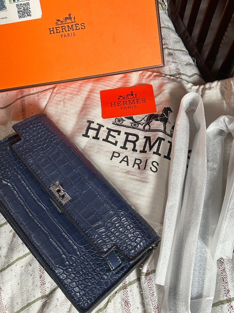 Hermès Kelly Sling Blue Crocodile (Category: Luxury Bags & Wallets) located in Manila. Submitted by keiscart_ (Listing ID 1409486611, Image 3). Description: - Kelly Sling Blue Crocodile - Blue crocodile leather - Includes original box, dust bag, and card - Silver-tone clasp - Matching blue interior - Made in France - Detachable strap.