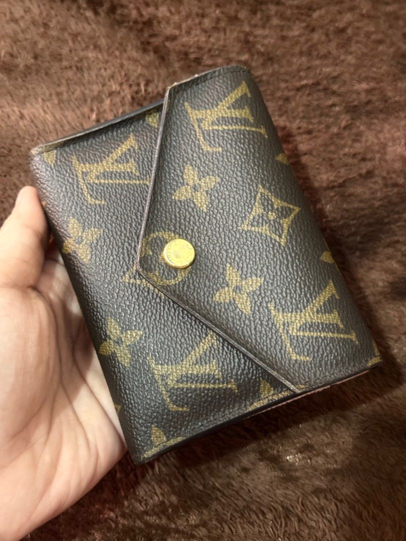 LOUIS VUITTON VICTORINE Monogram Wallet (Category: Luxury Bags & Wallets) located in Bulacan. Submitted by hereforless (Listing ID 1409475413, Image 2). Description: - Authentic Louis Vuitton wallet, bought in Singapore last 2022 - Iconic monogram pattern - Snap closure - Rose Ballerine interior - Features 6 card slots and a zippered compartment - Includes original box (with ribbon) and paper bag RFS: decluttering.