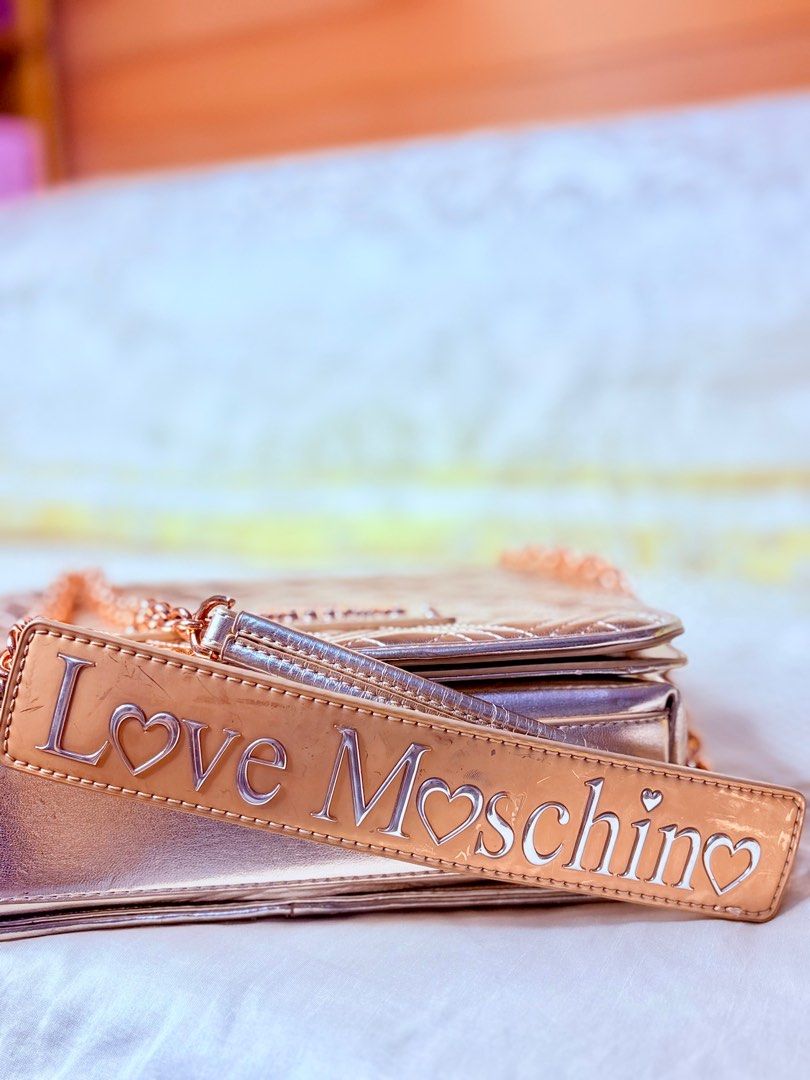 Love Moschino Rose Gold Bag (Category: Luxury Bags & Wallets) located in Quezon City. Submitted by pinky600 (Listing ID 1409448617, Image 3). Description: - Pre-loved Love Moschino handbag - Rose gold hardware - Quilted design - Chain strap - Includes dust bag and cards - Selling for ₱700 (SRP: ₱30,000).
