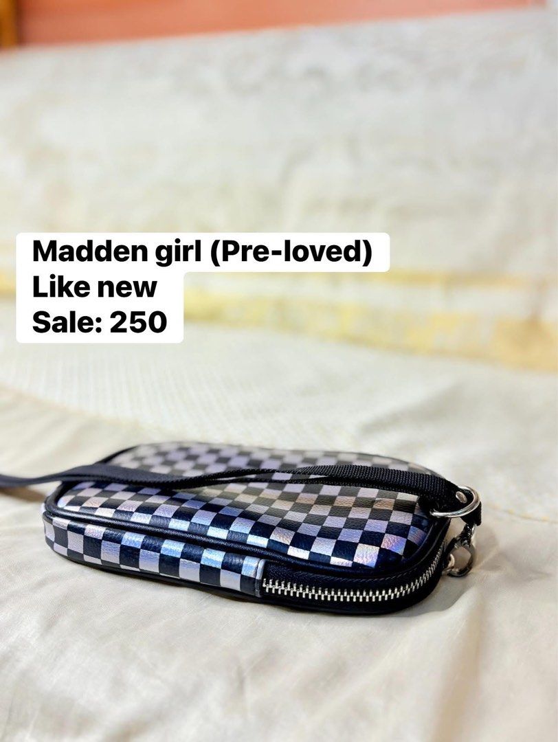 Madden Girl Checkerboard Bag (Category: Luxury Bags & Wallets) located in Quezon City. Submitted by pinky600 (Listing ID 1409450436, Image 1). Description: - Pre-loved Madden Girl bag - Unique checkerboard pattern - Zippered closure - Small strap - Black interior - "Madden Girl" zipper detail.