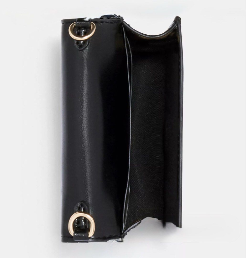 Mini Wallet On A Chain (Category: Luxury Bags & Wallets) located in Quezon. Submitted by achicoco (Listing ID 1409530994, Image 2). Description: - Authentic Coach wallet - Signature Walnut/Black- Brown Pattern - Gold chain strap - Black interior - Bought it sa Hawaii, USA - Last Price: 3800 PM FOR PICTURES .