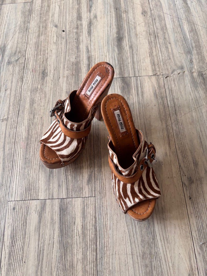 miu miu zebra print clogs/heels (Category: Heels) located in Paranaque City. Submitted by lovedbydevi (Listing ID 1409458684, Image 3). Description: miu miu clogs size 37 1/2 really wanted to keep but it sadly does not fit me flaws are seen in the pics, may black marks sya but di naman noticeable or nakakabother when worn. other than that good condition also open for trade preferable size 38/38.5 .