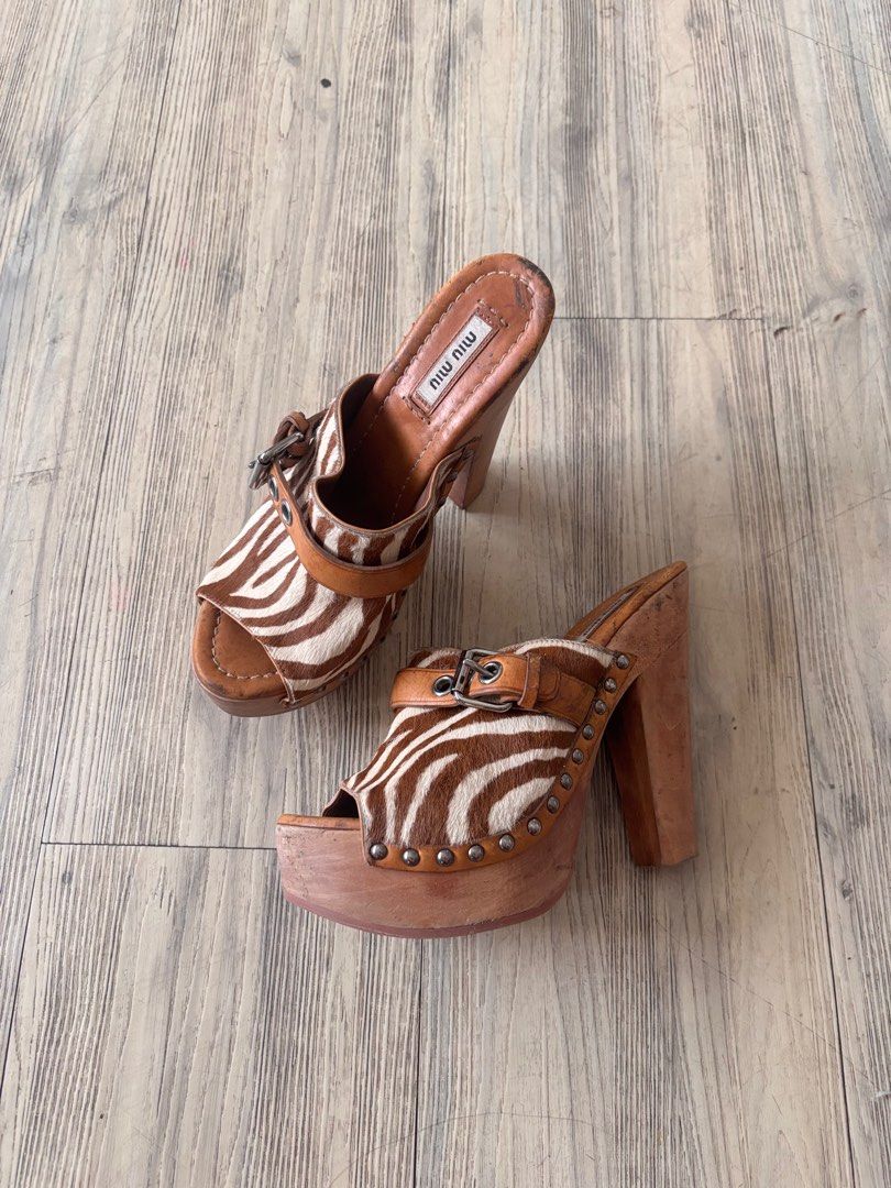miu miu zebra print clogs/heels (Category: Heels) located in Paranaque City. Submitted by lovedbydevi (Listing ID 1409458684, Image 2). Description: miu miu clogs size 37 1/2 really wanted to keep but it sadly does not fit me flaws are seen in the pics, may black marks sya but di naman noticeable or nakakabother when worn. other than that good condition also open for trade preferable size 38/38.5 .