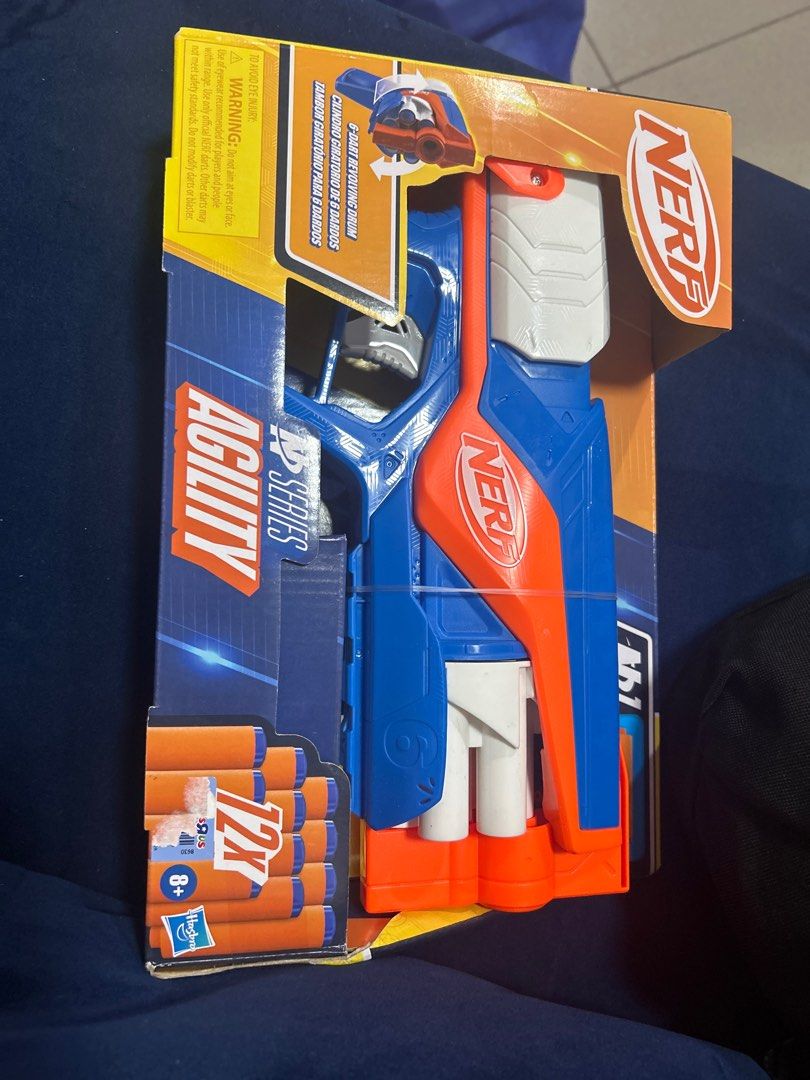 Selling Low: Nerf N-Strike Elite Series Agility (Category: Action & Battle Toys) located in Manila. Submitted by goodluckstuff (Listing ID 1409436507, Image 2). Description: - Nerf N-Strike Elite Agility toy gun - 6-dart revolving drum - Includes 12 darts - Recommended for ages 8+ - Color scheme: Blue, orange, and white - Features pull-back priming - Box indicates extreme accuracy, speed, and precision * Selling very low. Item must go. * Special 