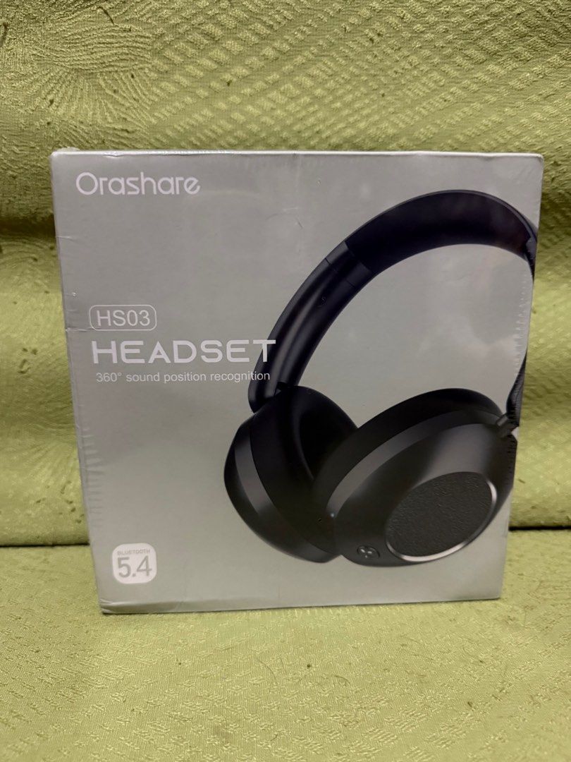 Orashare HS03 Bluetooth 5.4 Headset (Category: Headphones & Headsets) located in Quezon City. Submitted by demified (Listing ID 1409543033, Image 1). Description: - Orashare HS03 Headset - Bluetooth 5.4 - 360° Sound Position Recognition - Black headset design - "MUSIC" printed on the box Sealed pa!.