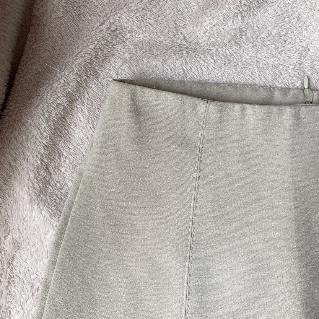 Plain Beige Gray Mini A-line Skirt (Category: Skirts) located in Taguig. Submitted by anndefined (Listing ID 1409466536, Image 3). Description: - Classic mini A-line skirt - barely used, in good condition - best fit xs frames (24" waist).