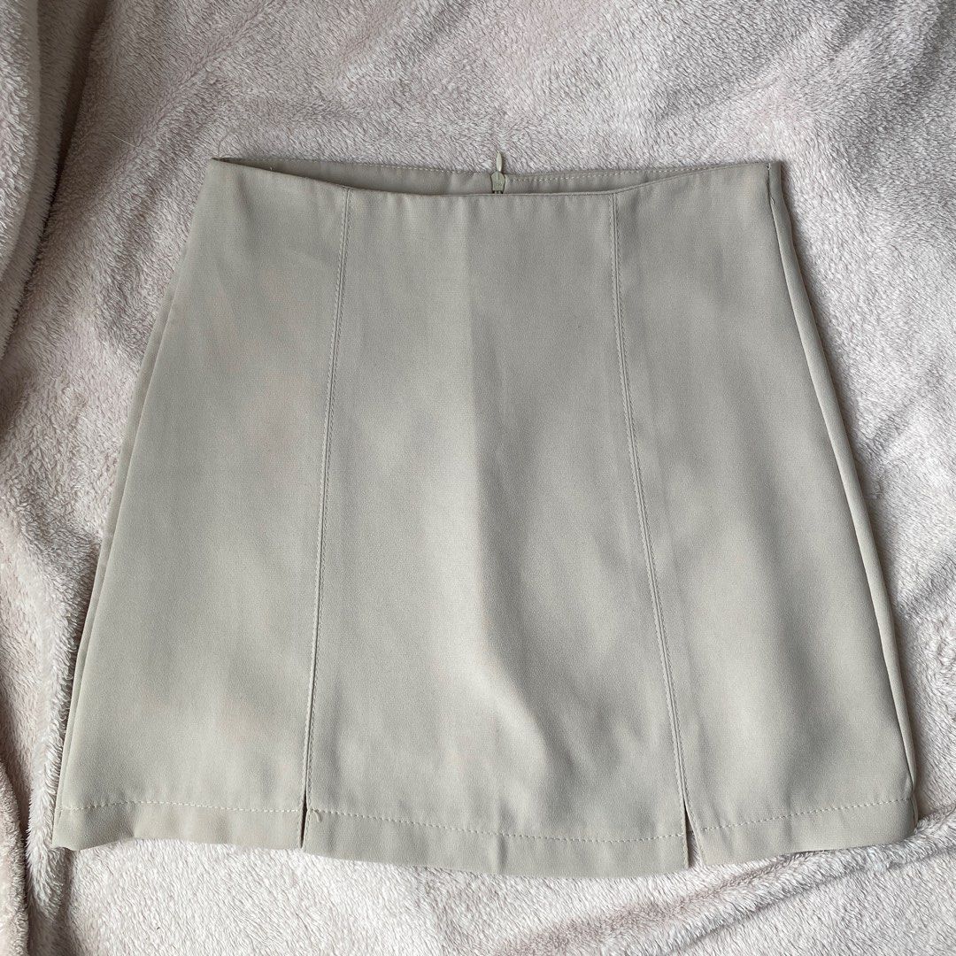 Plain Beige Gray Mini A-line Skirt (Category: Skirts) located in Taguig. Submitted by anndefined (Listing ID 1409466536, Image 2). Description: - Classic mini A-line skirt - barely used, in good condition - best fit xs frames (24" waist).