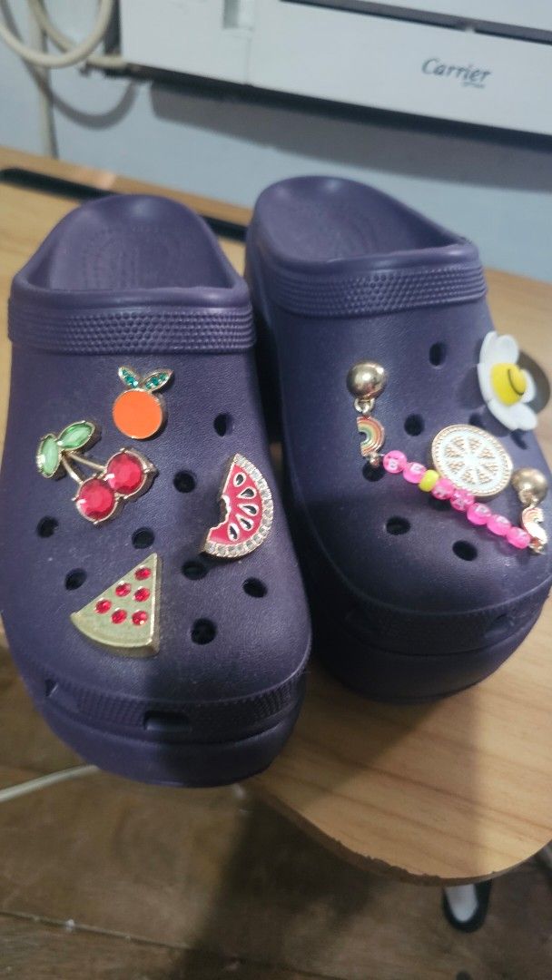Purple Crocs with Jibbitz (Category: Flats & Sandals) located in Manila. Submitted by sereenity (Listing ID 1409484553, Image 1). Description: - Purple platform Crocs sandals - Decorated with flower, lemon, watermelon, cherry, and rainbow jibbitz Multiple holes for jibbitz customization - Features the Crocs logo. 23cm actual size .