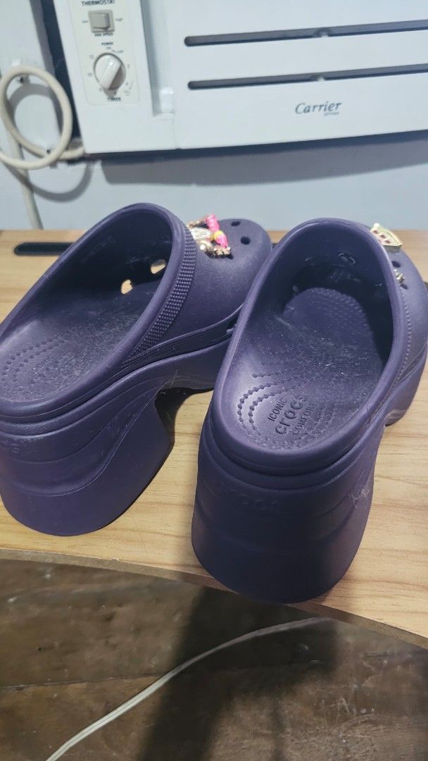 Purple Crocs with Jibbitz (Category: Flats & Sandals) located in Manila. Submitted by sereenity (Listing ID 1409484553, Image 3). Description: - Purple platform Crocs sandals - Decorated with flower, lemon, watermelon, cherry, and rainbow jibbitz Multiple holes for jibbitz customization - Features the Crocs logo. 23cm actual size .
