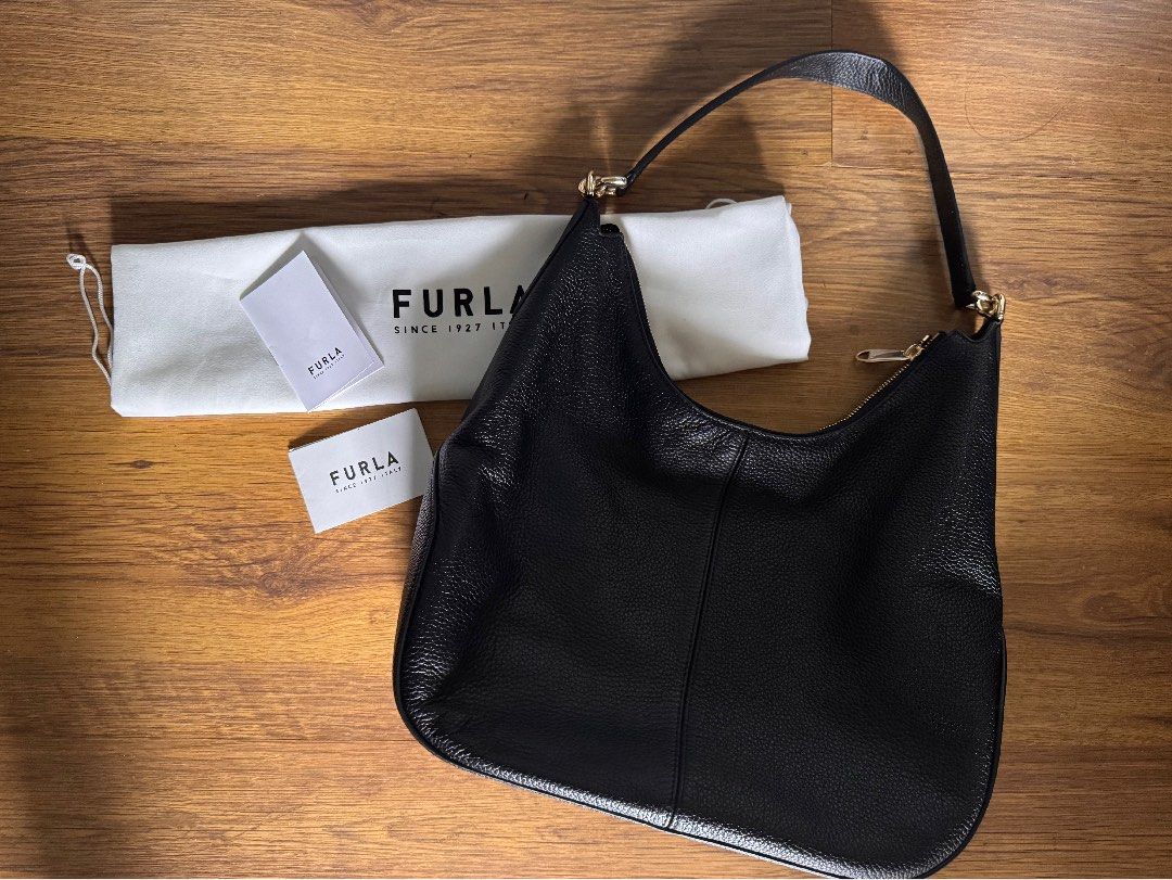 RUSH SALE! Guaranteed Authentic FURLA Bag (Category: Luxury Bags & Wallets) located in Muntinlupa City. Submitted by our_little_closet (Listing ID 1409437676, Image 1). Description: Guaranteed authentic FURLA leather shoulder bag Color: black with gold hardware RFS: decluttering This ba was bought late last year only in FURLA store. It was used once only! Another impulse buy from a trip. It is in like bnew condition. Leather has no flaws and gold