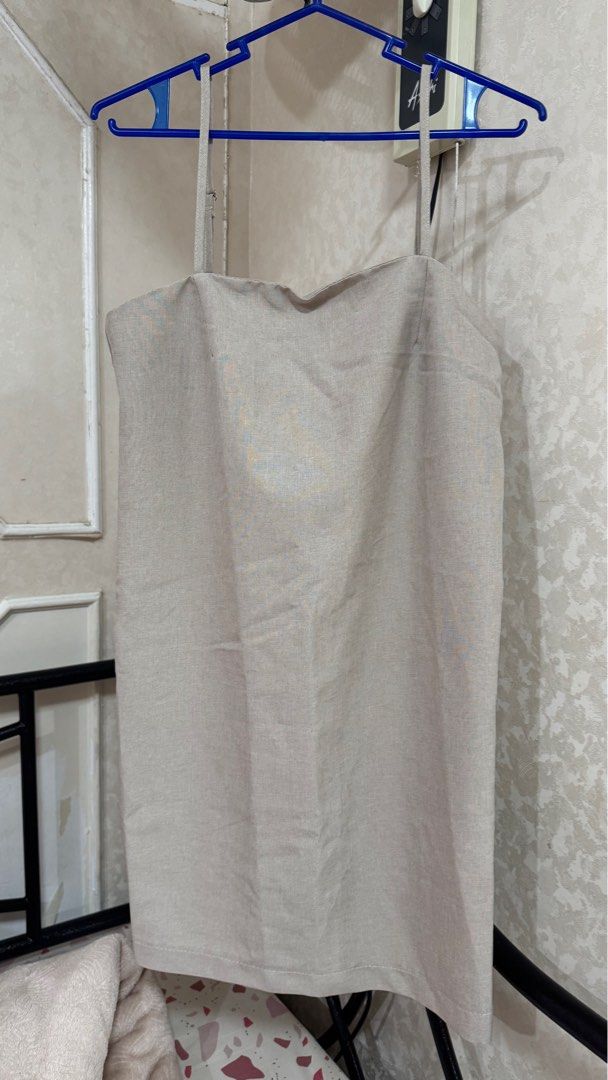 Shein Linen Top - XS (Category: Sleeveless) located in Quezon City. Submitted by declutterrringme (Listing ID 1409497183, Image 1). Description: - Linen top - Size: XS - Design: Thin straps, straight cut - Color: Neutral - Style: Versatile for casual outfits.