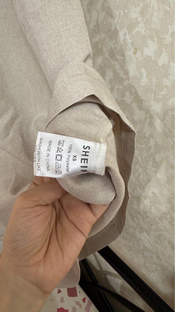 Shein Linen Top - XS (Category: Sleeveless) located in Quezon City. Submitted by declutterrringme (Listing ID 1409497183, Image 2). Description: - Linen top - Size: XS - Design: Thin straps, straight cut - Color: Neutral - Style: Versatile for casual outfits.