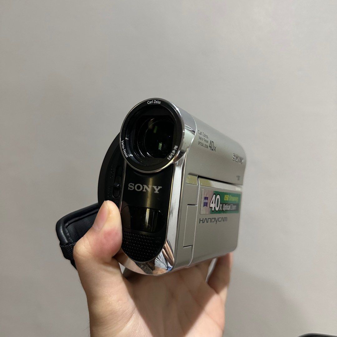 Sony Handycam DCR-HC54 (Category: Video Cameras) located in Manila. Submitted by rheinvg (Listing ID 1409443302, Image 1). Description: Sony Handycam DCR-HC54 with Carl Zeiss lens, 40x optical zoom, and USB streaming. Silver and black color. Includes hand strap. — super old casette video recorder - still boots up - not sure if lcd screen is still working - uses casette, not sd card - mind your expectations ! selling this kesa itapon lang nego for