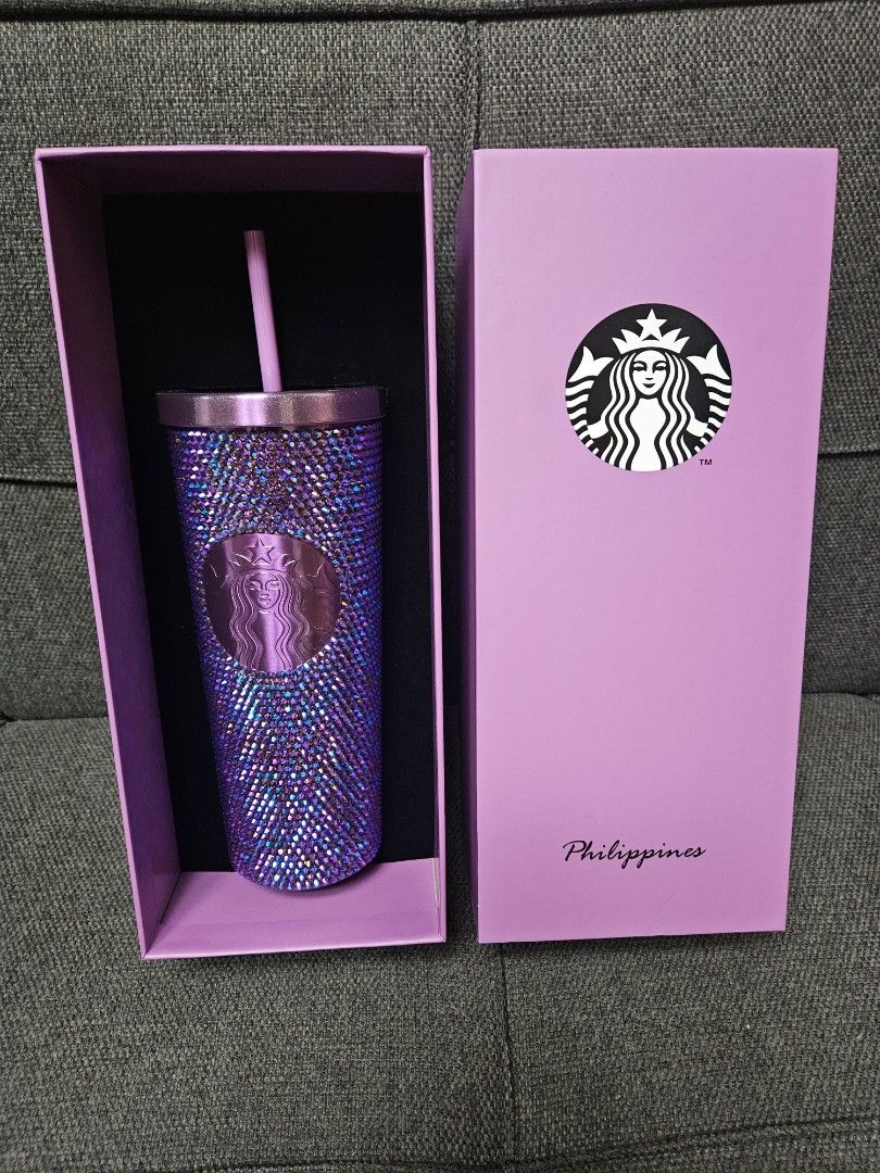 Starbucks Philippines Purple Rhinestones (Category: Water Bottles & Tumblers) located in Quezon City. Submitted by petite_kopichesg (Listing ID 1409448848, Image 1). Description: - Dazzling purple rhinestone-covered Starbucks tumbler - Includes matching straw - Comes in a lilac box - Box features Starbucks logo and "Philippines" - Ideal for Starbucks enthusiasts - Declutter - All sales are final - Fixed price - No return, no refund - Will not rel