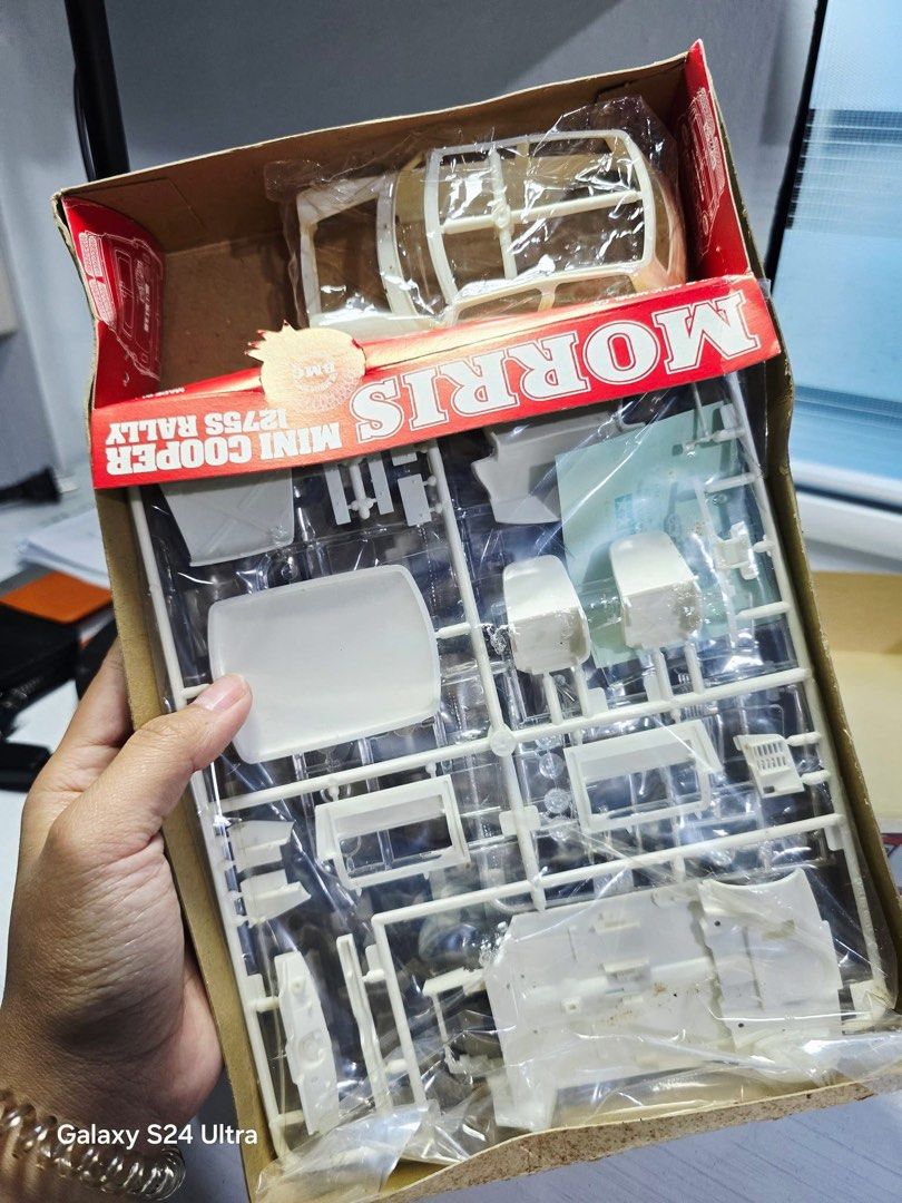 Tamiya Morris Mini Cooper 1275S Rally Model Kit (Category: Vehicle & Diecast Models) located in Baguio. Submitted by thrifty_cool (Listing ID 1409613654, Image 3). Description: - Tamiya Morris Mini Cooper 1275S Rally model kit - 1/24 scale - Released in 1984 - Made in Japan - Box art features a red car with number 177 - Includes unassembled parts and instructions.
