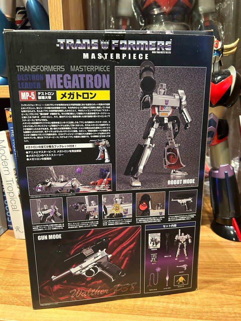 Transformers Masterpiece MP-5 Destron Leader Megatron (Category: Action & Battle Toys) located in Manila. Submitted by int38 (Listing ID 1409521175, Image 2). Description: - Transformers Masterpiece MP-5 Megatron action figure - Includes accessories: gun, purple energy blade, and large black cannon - Comes in original packaging - Box features images of robot and gun modes - Highly detailed and a collector's item Back in Box Just opened for checki