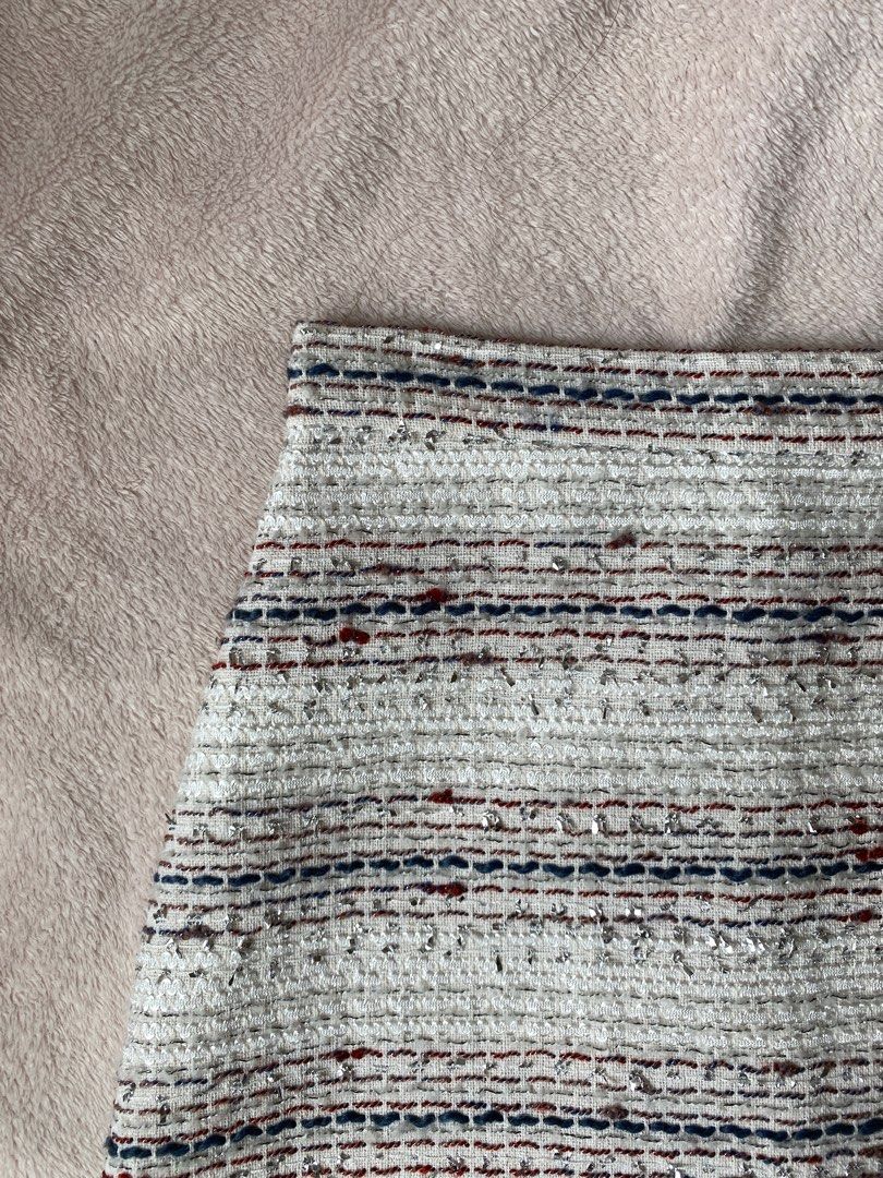 Tweed Mini A-Line Skirt (Category: Skirts) located in Taguig. Submitted by anndefined (Listing ID 1409466092, Image 2). Description: - Tweed mini skirt - Color: White, blue, and red - A-line - best fit xs frames (24" waist) - thrifted but in good condition - with thin inner shorts and lining - perfect for parties.