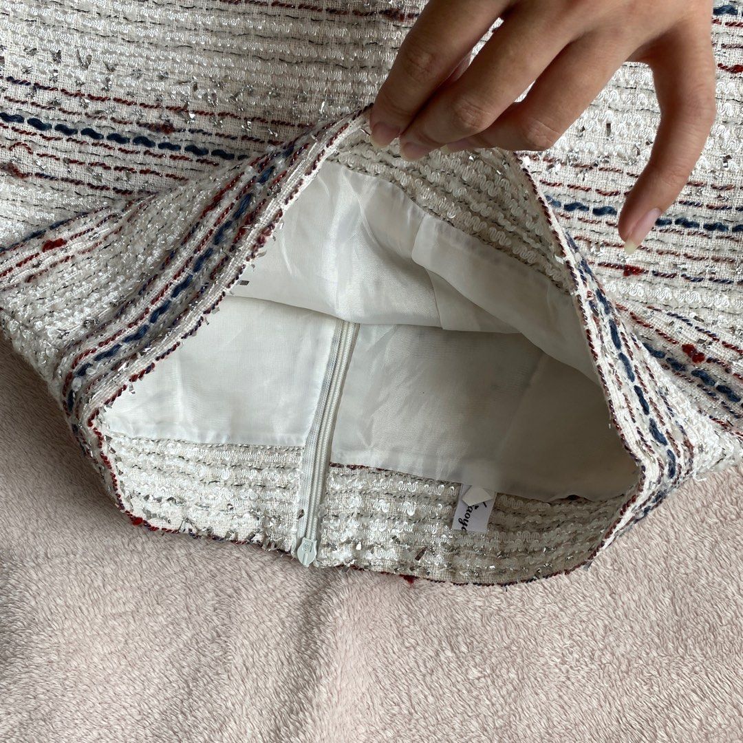 Tweed Mini A-Line Skirt (Category: Skirts) located in Taguig. Submitted by anndefined (Listing ID 1409466092, Image 3). Description: - Tweed mini skirt - Color: White, blue, and red - A-line - best fit xs frames (24" waist) - thrifted but in good condition - with thin inner shorts and lining - perfect for parties.