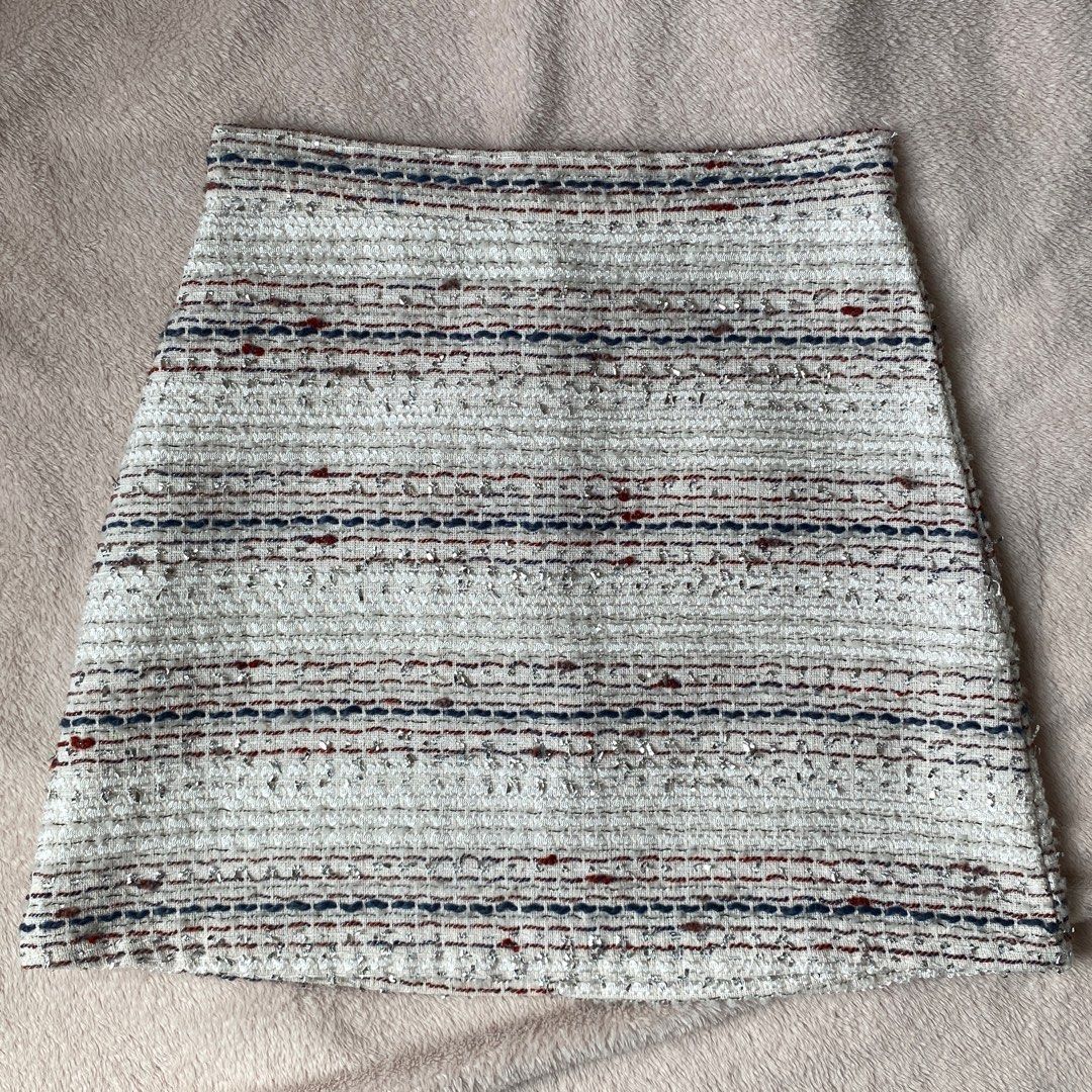 Tweed Mini A-Line Skirt (Category: Skirts) located in Taguig. Submitted by anndefined (Listing ID 1409466092, Image 1). Description: - Tweed mini skirt - Color: White, blue, and red - A-line - best fit xs frames (24" waist) - thrifted but in good condition - with thin inner shorts and lining - perfect for parties.