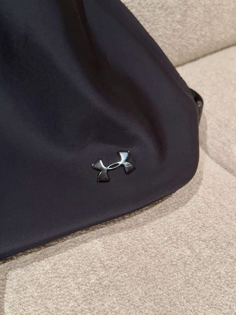 UNDER ARMOUR Drawstring Backpack (Category: Backpacks) located in Singapore. Submitted by lohmxy (Listing ID 1409578708, Image 3). Description: Height 37cm Depth 17cm Width 41cm It has a fairly large capacity. The fabric and material are soft, similar to a laptop case. Black color, no exterior or interior pockets. Adjustable shoulder straps. See photos for wrinkles from storage. It doesn’t interfere with use, but please refrain from purchasing if