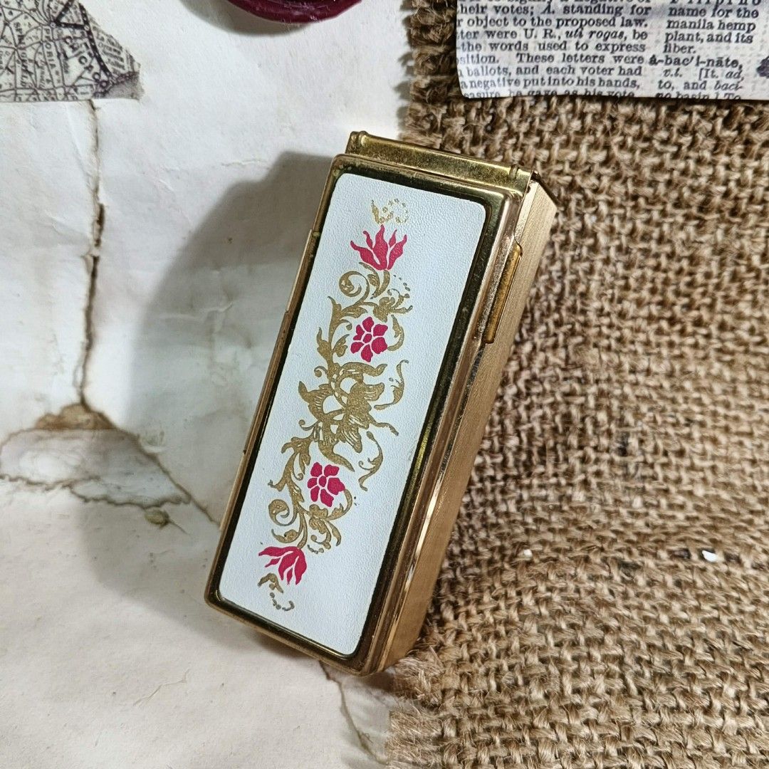 VINTAGE SHISEIDO LIPSTICK HOLDER (Category: Makeup) located in Valenzuela. Submitted by shikkufindsmla (Listing ID 1409591267, Image 1). Description: WYSIWYG - Vintage Shiseido compact - Elegant gold-toned exterior - Features a beautiful floral design - Includes a mirror and a small brush - Opens to reveal a compartment for lipstick. - Authentic Shiseido logo *signs of usage w/ some tarnished parts. .