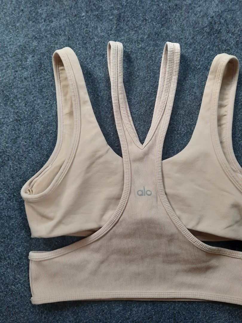 Alo Yoga Trackie Sports Bra long line cage cut out (Category: Activewear) located in San Jose del Monte. Submitted by leslymhey (Listing ID 1409620280, Image 2). Description: - Beige Alo Yoga sports bra - Size: M - Features a unique strappy design - Ribbed detailing - Padded - Comfortable and stretchy fabric - Ideal for yoga, pilates, and workouts.