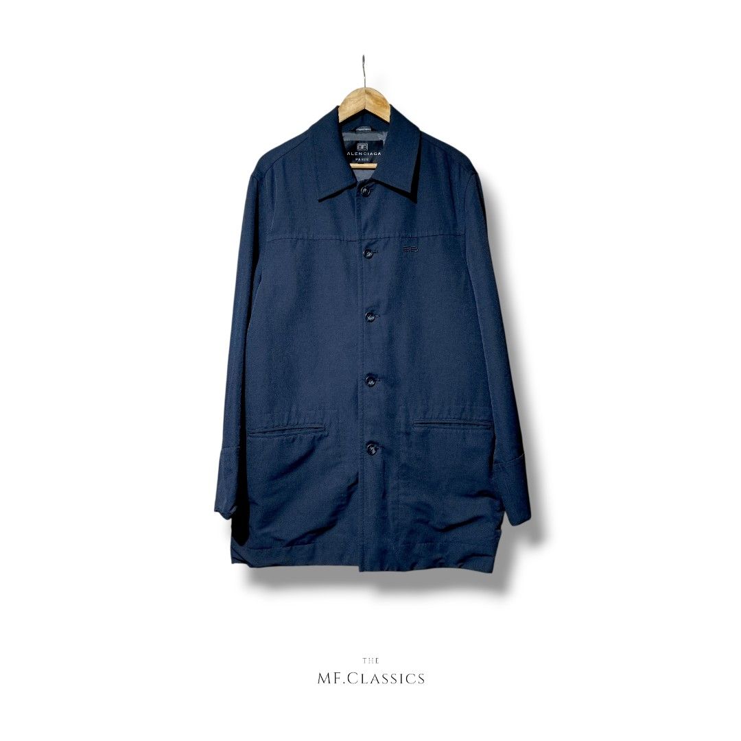 Balenciaga Jacket (Navy Blue) (Category: Coats, Jackets and Outerwear) located in Manila. Submitted by mf.classics (Listing ID 1409745948, Image 1). Description: - Balenciaga Paris navy jacket - Button-down front - Two front pockets - Classic collar - Subtle Balenciaga logo embroidery - Full lining - Tailored fit - Versatile for various occasions - Measurements: 32 L 22 W.
