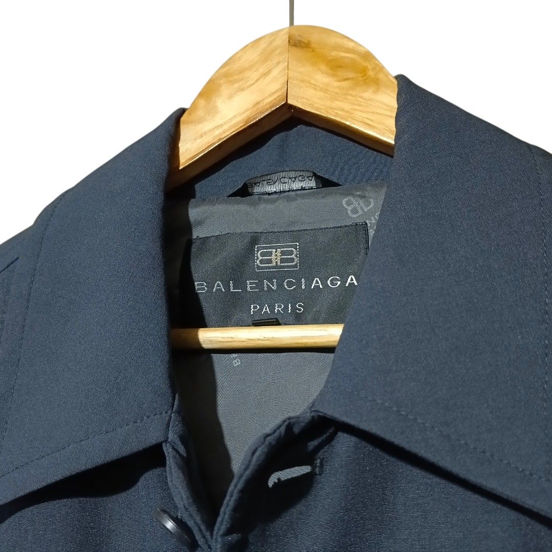 Balenciaga Jacket (Navy Blue) (Category: Coats, Jackets and Outerwear) located in Manila. Submitted by mf.classics (Listing ID 1409745948, Image 3). Description: - Balenciaga Paris navy jacket - Button-down front - Two front pockets - Classic collar - Subtle Balenciaga logo embroidery - Full lining - Tailored fit - Versatile for various occasions - Measurements: 32 L 22 W.
