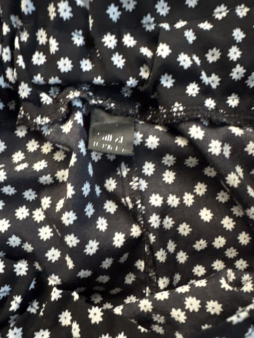 Black Floral Skirt (Category: Skirts) located in Quezon City. Submitted by authentic_c (Listing ID 1409672365, Image 3). Description: - Black skirt with white floral pattern - Features a ruffled hem - Comfortable elastic waistband - Made of lightweight fabric - Ideal for warm weather - Versatile style for casual wear Shein skort.