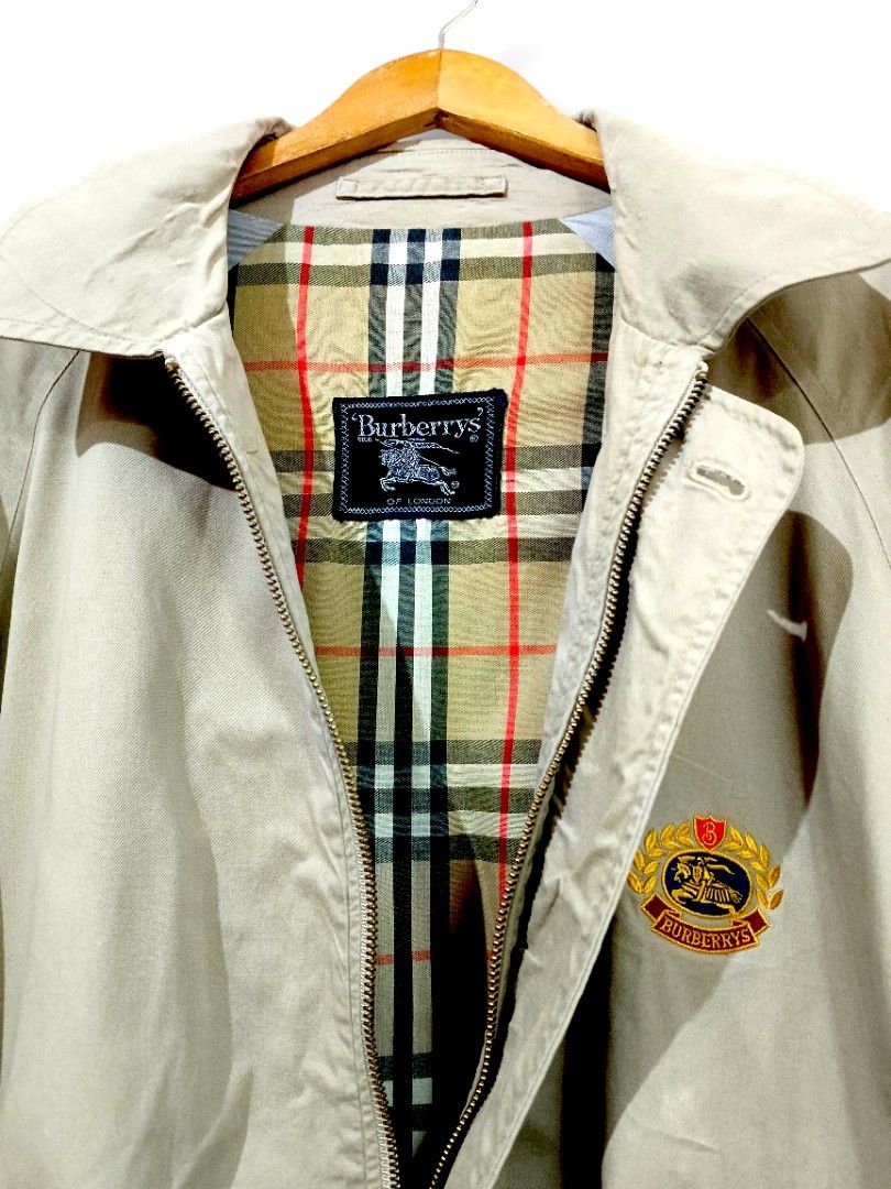 Burberry Harrington Jacket (Beige) (Category: Coats, Jackets and Outerwear) located in Manila. Submitted by mf.classics (Listing ID 1409760963, Image 2). Description: - Authentic Burberrys jacket - Beige color - Iconic Burberry check lining - Button closure - Two front pockets - Made in USA - Classic and timeless style - Measurements: 27 L 23 W.