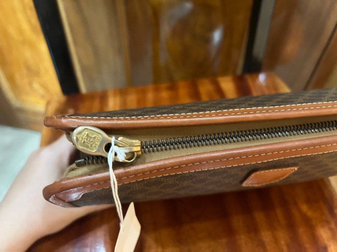 Celine Macadam Clutch (Category: Luxury Bags & Wallets) located in Cebu City. Submitted by cringedeclutters (Listing ID 1409672211, Image 3). Description: - Authentic Celine clutch bag - Iconic Macadam pattern - Brown leather trim - Zipper closure with Celine logo pull - Interior tag with style name and price - Made in Italy NEGOTIABLE.