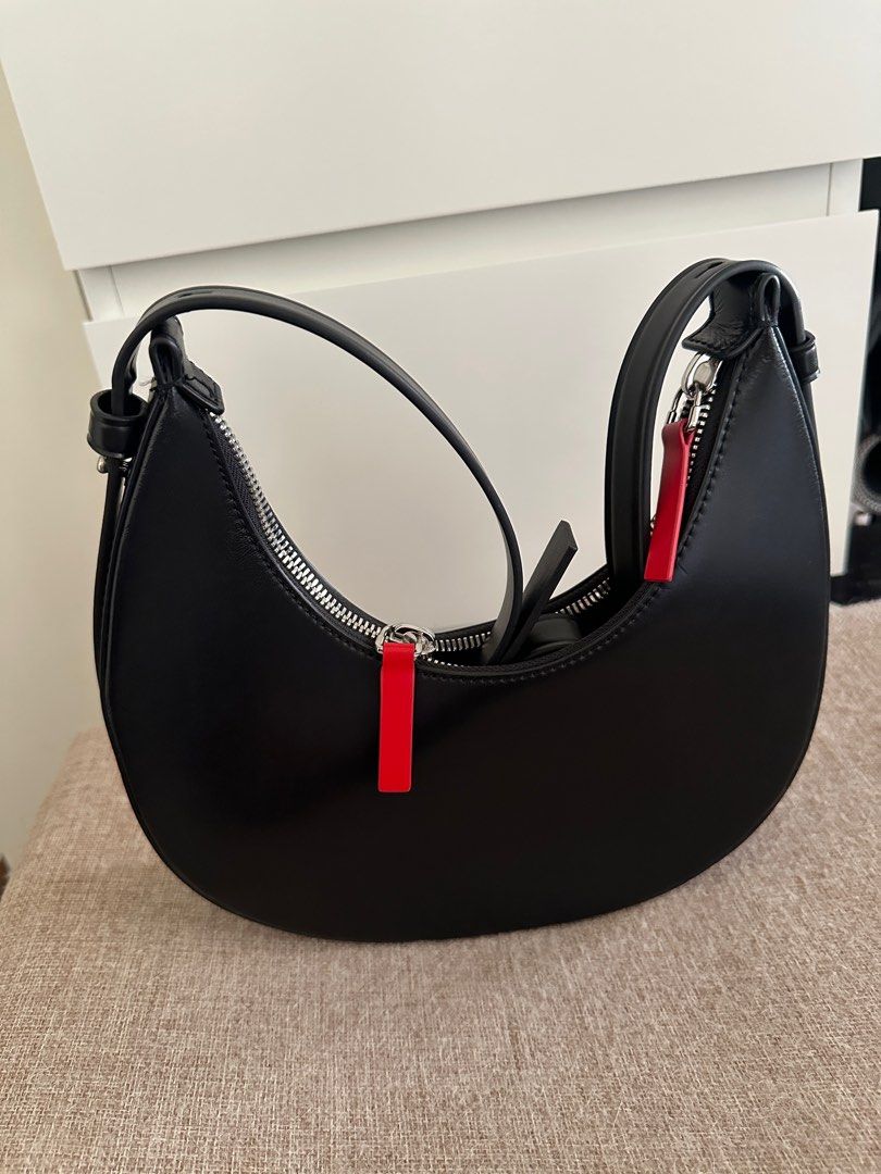 Charles & Keith Noir Carey Crescent Bag (Category: Luxury Bags & Wallets) located in Taguig. Submitted by declutterwithjoey (Listing ID 1365066706, Image 3). Description: Charles & Keith Noir Carey Crescent Bag - Seldomly used - No issues, with straps and keychains - Retails ₱3xxx - RFS: too many bags DECLUTTER WITH ME 🧹 PAMIGAY PRICE ‼️ - All items authentic unless stated no brand - Pay as you order basis. First to pay gets item ▪️📍Taguig ▪️ g