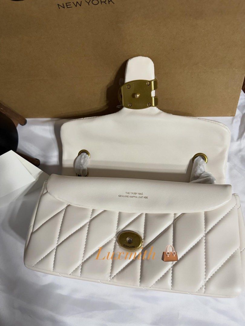 Coach Tabby Shoulder Bag 26 With Quilting white (Category: Luxury Bags & Wallets) located in Manila. Submitted by lux.mith (Listing ID 1409695896, Image 3). Description: SALE! limited stocks. 💯 NOW: 3,500 only + free shipping (before: 4,500) • On hand and ready to ship • No reservation • Confirmed once paid. *ACTUAL PHOTO POSTED* DM TO ORDER DISCLAIMER: Luxmith is not affiliated or associated with any brand posted. No infringement intended. All 