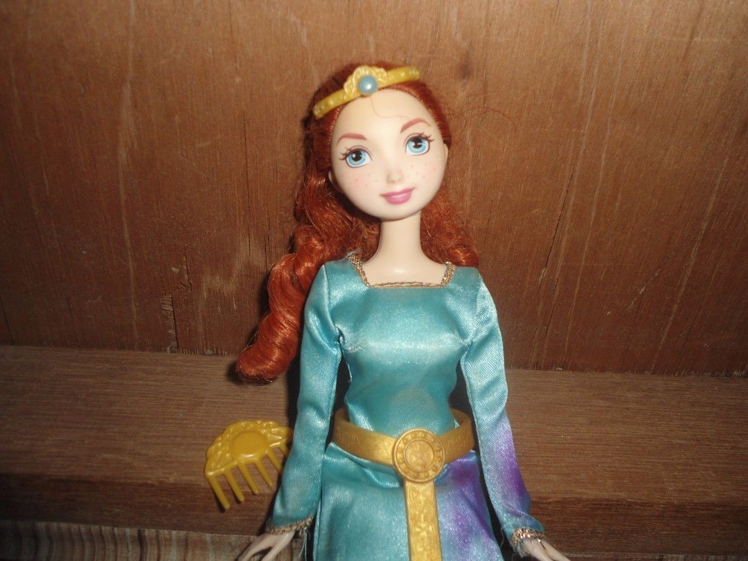 Disney Brave Merida Doll Mattel (Category: Figurines & Statues) located in Manila. Submitted by magi_declutters (Listing ID 1409710360, Image 2). Description: Disney Dolls Brave Mattel Original ₱800 2006 — Made in Indonesia 🎈 INCLUSION : Crown, comb accessory 🔥 ISSUE : Stain on dress 📍 Rodriguez Rizal / San mateo 📍 JNT / Lalamove pm for more details !!.