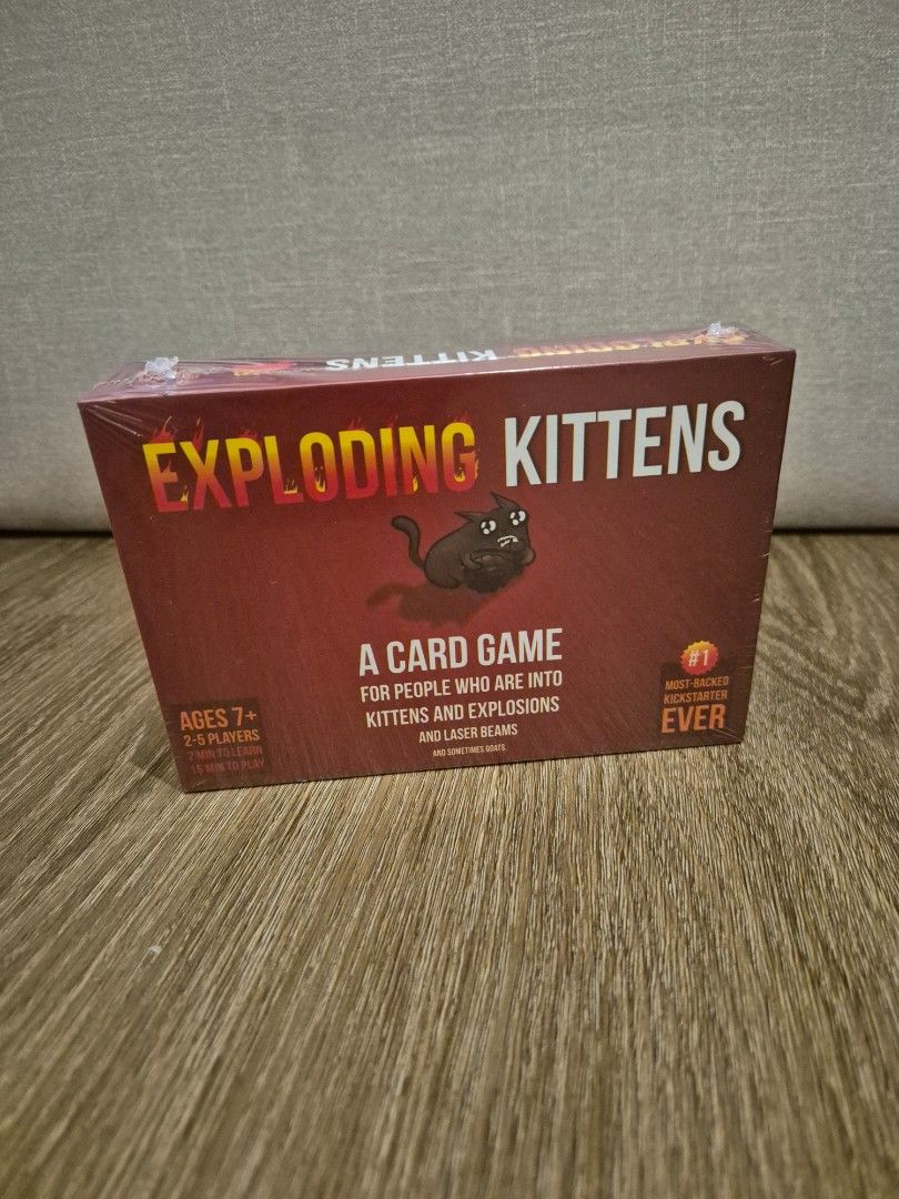 Exploding Kittens Card Game (Category: Board Games & Puzzles) located in Singapore. Submitted by shinobe (Listing ID 1409732367, Image 1). Description: - Exploding Kittens card game - Brand new and sealed - Suitable for ages 7+ - Fun and engaging gameplay Self collect at Tampines MRT..