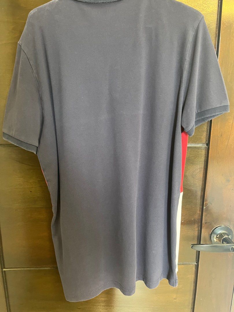 Giordano Polo Shirt - Size L (Category: Tshirts & Polo Shirts ) located in Santa Rosa. Submitted by declutter.jenjen (Listing ID 1409630217, Image 3). Description: - Personal not thrifted -Giordano polo shirt - Color block design: navy, red, and white - Size: L - Features a classic polo collar - Short sleeves - Button-up placket - Tapered fit.
