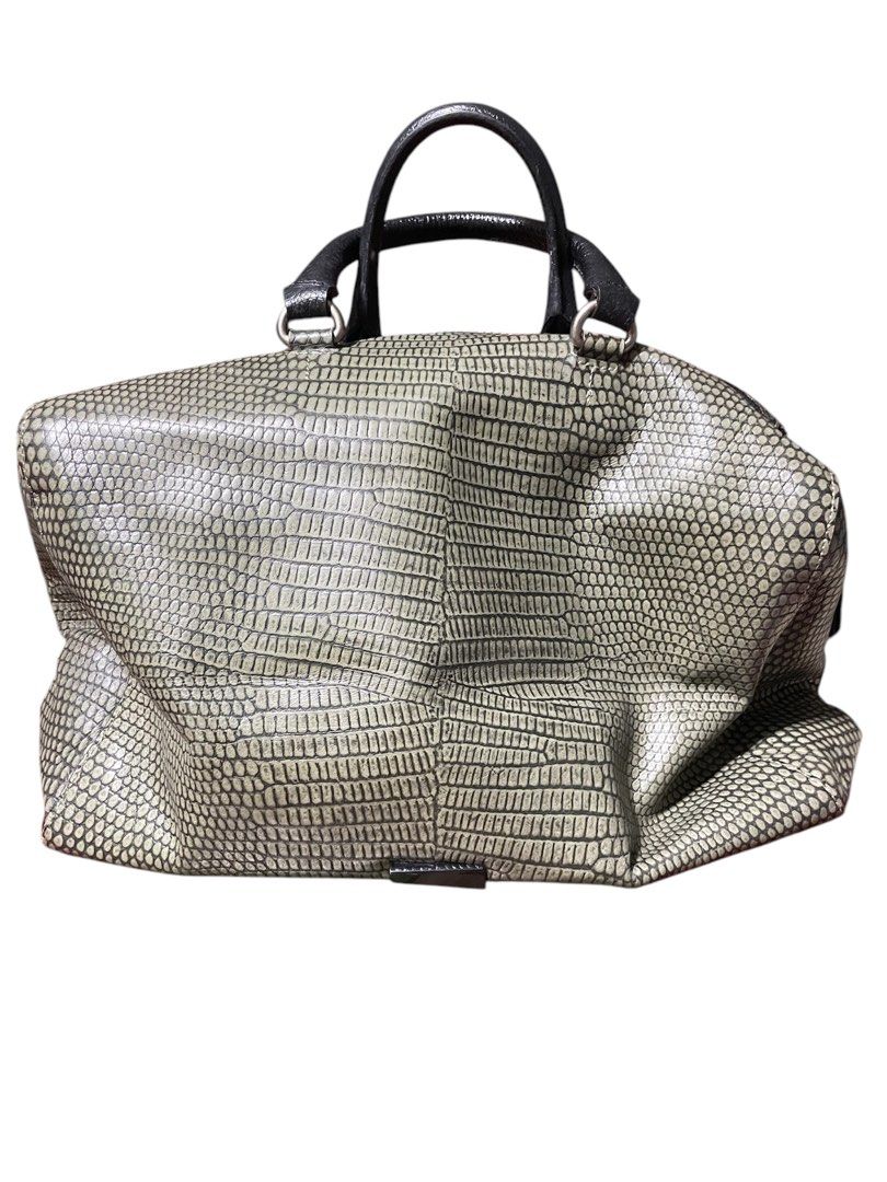 Grey Reptile-Patterned Handbag (Category: Luxury Bags & Wallets) located in Cavite. Submitted by prettykailee1008 (Listing ID 1409742367, Image 1). Description: - Grey reptile-patterned design - Black handles - Silver-colored hardware - Spacious, rounded shape - Zipper closure - Suitable for everyday use.