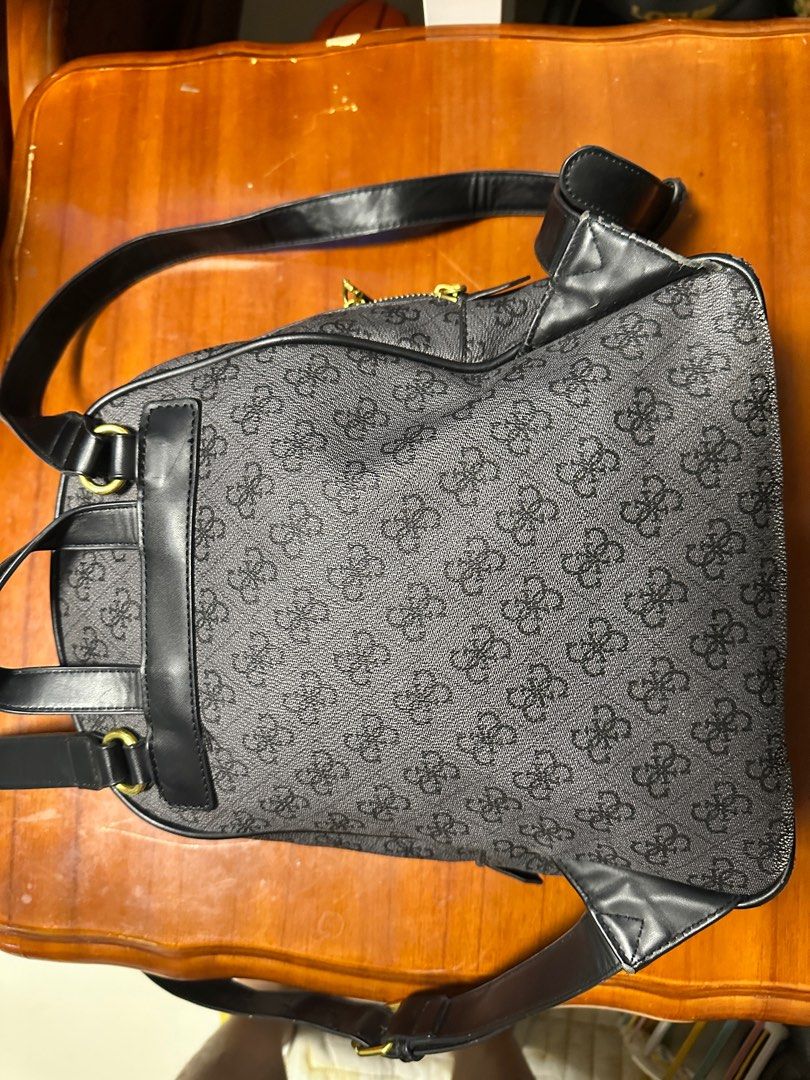 Guess Monogram Backpack (Category: Backpacks) located in Tarlac. Submitted by bea_declutters2022 (Listing ID 1409648607, Image 3). Description: - Guess backpack with monogram design - Main compartment and front zippered pocket - Interior zippered pocket - Adjustable shoulder straps - Gold-toned hardware - Top handle -Free shipping -Payment first policy .