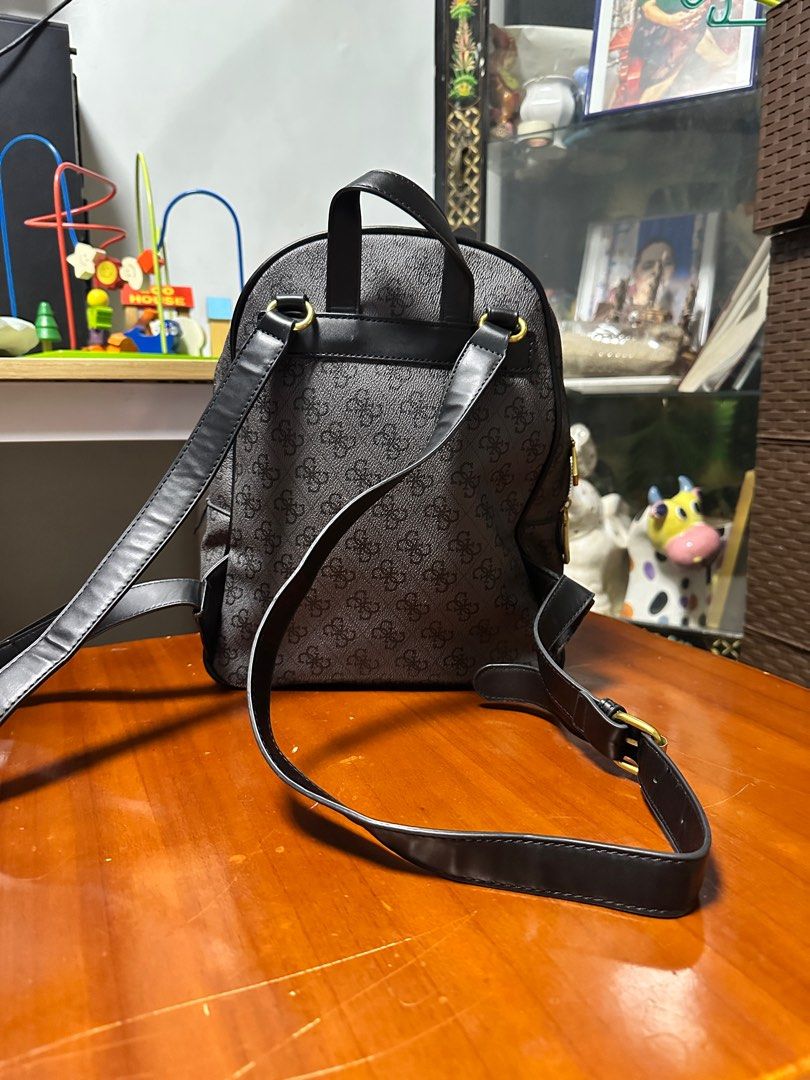 Guess Monogram Backpack (Category: Backpacks) located in Tarlac. Submitted by bea_declutters2022 (Listing ID 1409648607, Image 2). Description: - Guess backpack with monogram design - Main compartment and front zippered pocket - Interior zippered pocket - Adjustable shoulder straps - Gold-toned hardware - Top handle -Free shipping -Payment first policy .