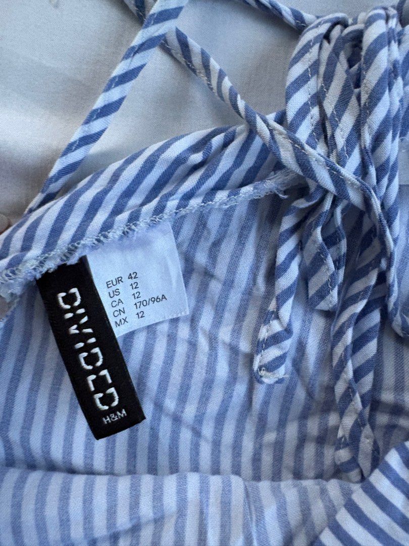 H&M Divided Striped Romper (Category: Rompers) located in Quezon City. Submitted by authentic_c (Listing ID 1409673255, Image 2). Description: - H&M Divided romper - Blue and white striped pattern - Halter neck design - Flared bottom - Size: EUR 42, US 12, CA 12, MX 12 - Lightweight fabric - perfect for warm weather.