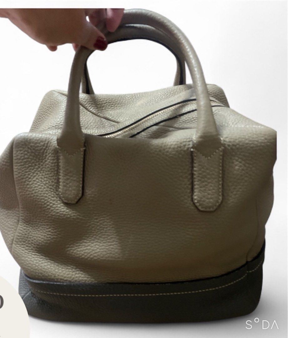 Leather Handbag with Dual Handles (Category: Luxury Bags & Wallets) located in Cavite. Submitted by prettykailee1008 (Listing ID 1409741708, Image 1). Description: - Two-tone design: light beige upper, darker bottom - Dual handle design - Textured leather appearance - Secure zipper closure - Spacious interior - Ideal for daily use.